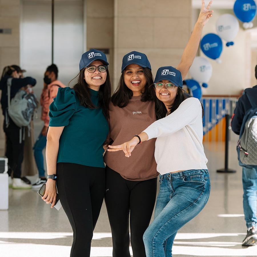 Three UMass Boston students pose at Beacon Spirit Days